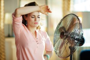 woman in front of fan
