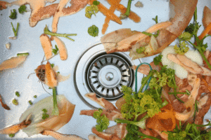 Kitchen sink and drain clogged with food