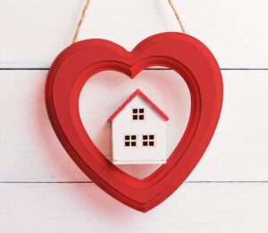 A heart decoration with a house in the middle
