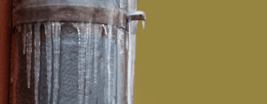 Water frozen on the outside of a pipe